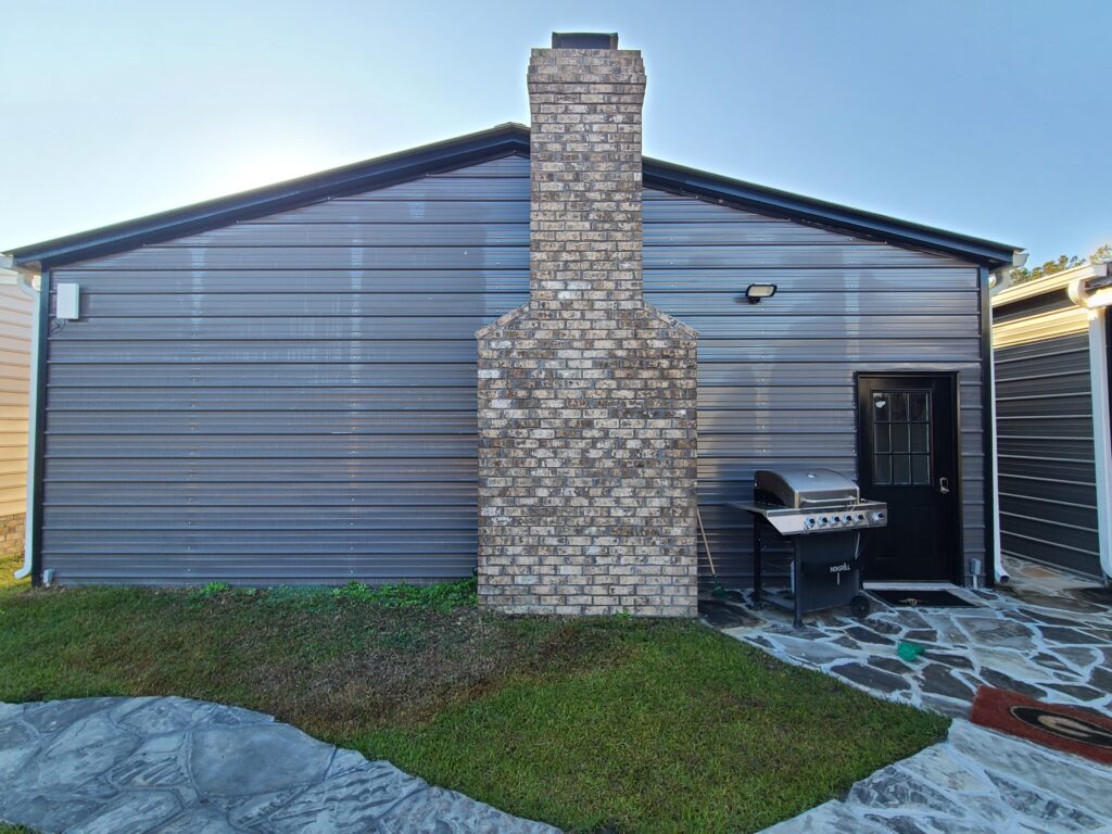 A brick oven sitting in front of a building.